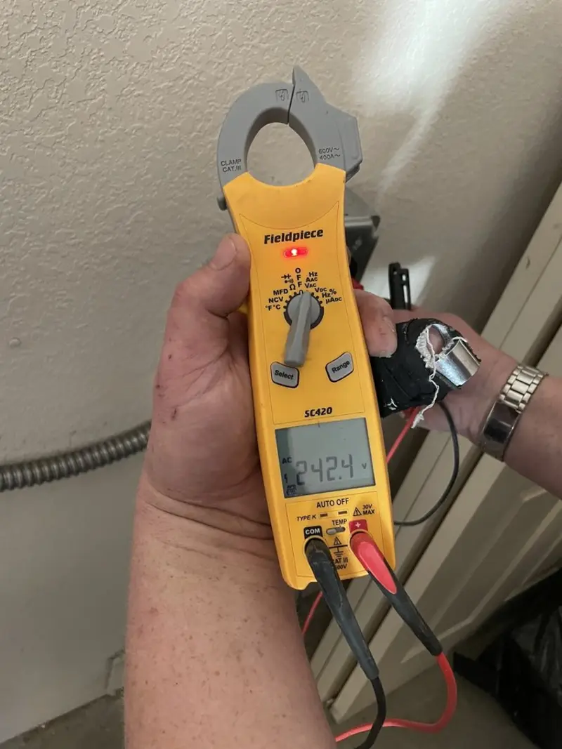 Voltage testing with clamp meter during Circuit Breaker Repair in St. Marys